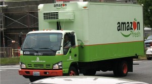 Amazon Fresh trucks carrying supplies to retailers